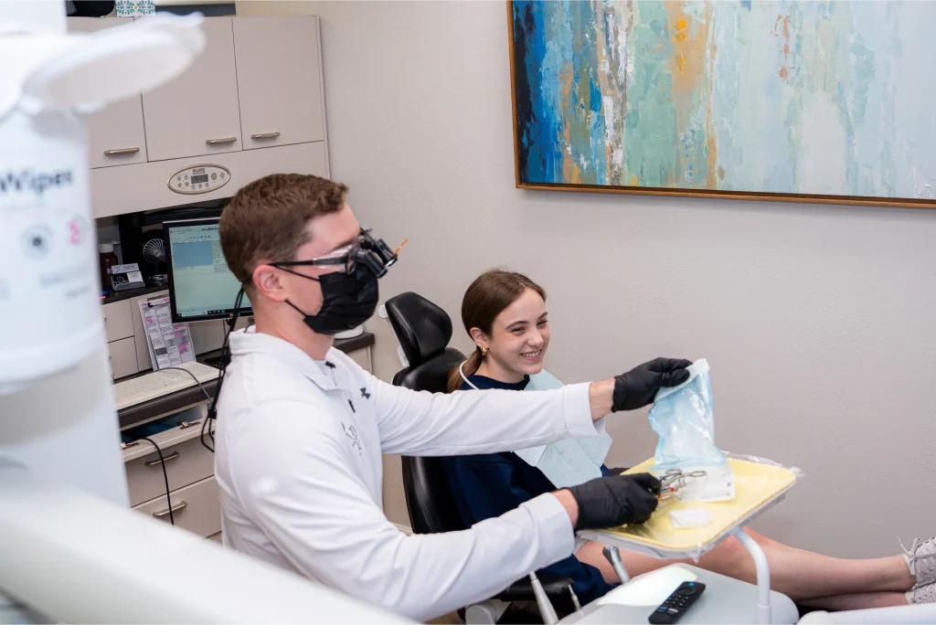 Dr. Austin with patient in dental chair | simple tooth extractions and wisdom teeth removal in Lenexa, KS