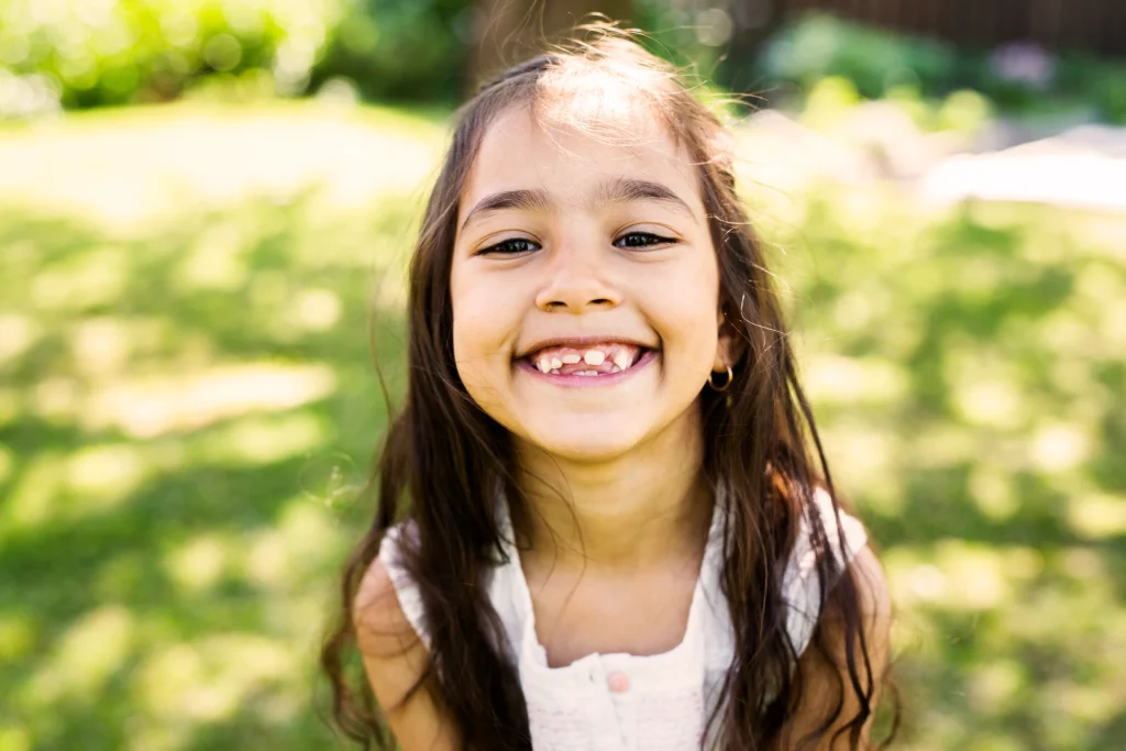 Young girl smiling | HealthyStart dentistry in Lenexa, KS